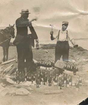Ed Regenhardt (left) destroying bottles of champaign