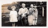 Irlene Poe, John T McNeely, Alice Regenhardt on his lap, Jennie Stevenson, Sloan Tuschoff